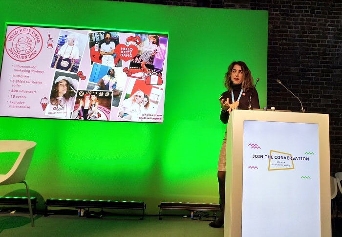 Martina Longueira with a slide detailing Hello Kitty's micro-influencer strategy